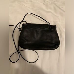 The Row bourse clutch in black leather